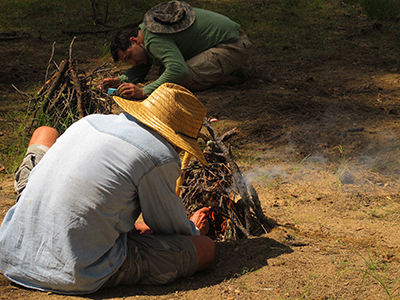 Making fire with a half paper match.