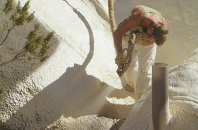 Spraying closed-cell foam for insulation and greater water-proofing.