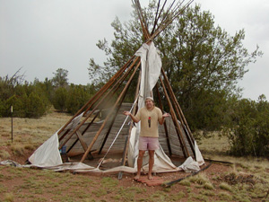 Cody beside yet another dead canvas shelter killed by Arizona weather. Sunforger canvas my ass!