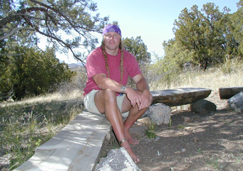 Cody beside yet another dead canvas shelter killed by Arizona weather. Sunforger canvas my ass!